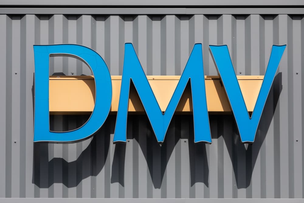 DMV signage on the front entrance of the DMV building